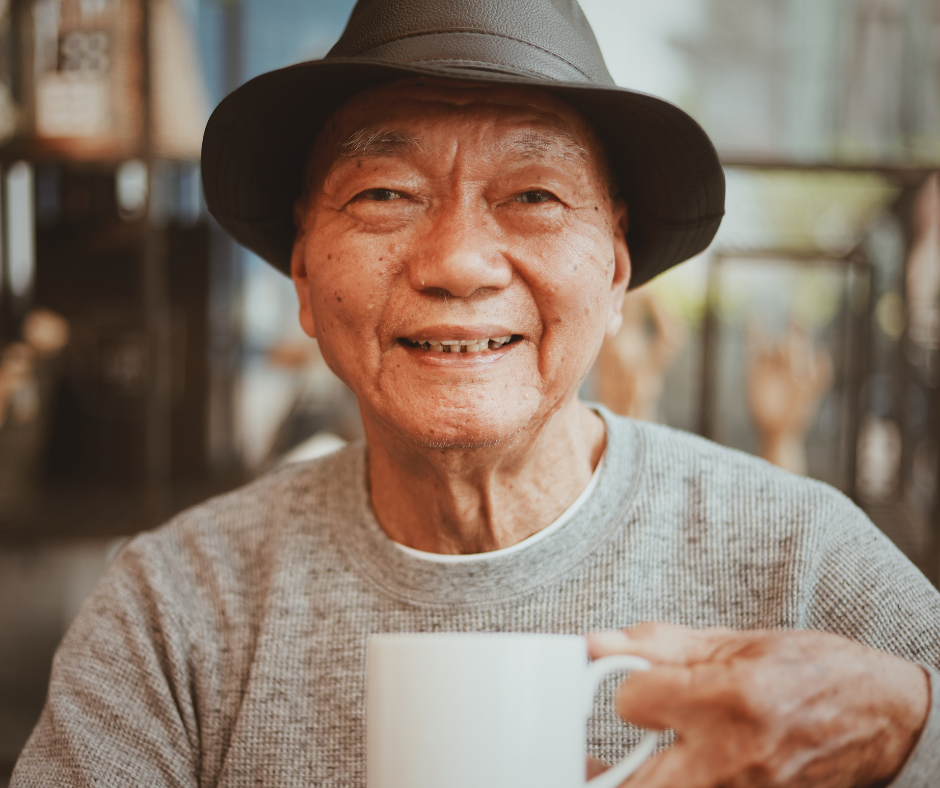 Senior man enjoying coffee in a memory cafe